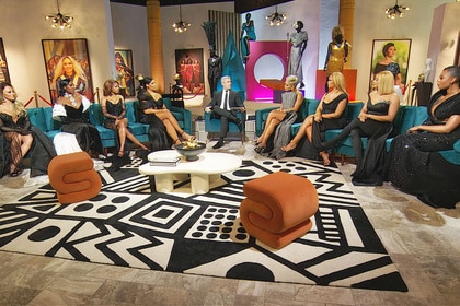 Andy Cohen and The Real Housewives of Potomac cast sitting at the Season 8 Reunion.