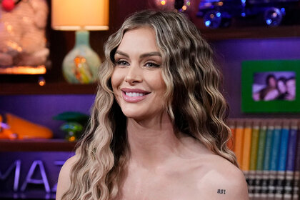 Lala Kent smiling as she sits as a guest on WWHL
