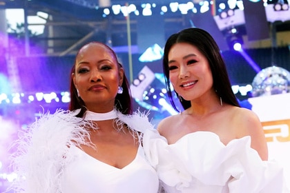 Garcelle Beauvais and Crystal Kung Minkoff posing next to each other at SoFi Stadium.