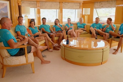 Captain Kerry Titheradge and the Below Deck crew sitting together.