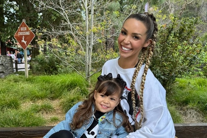 Scheana Shay and Summer Moon sitting together and smiling outdoors.