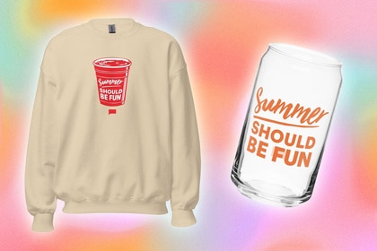 A sweatshirt and a glass with quotes on them overlaid onto a colorful background.