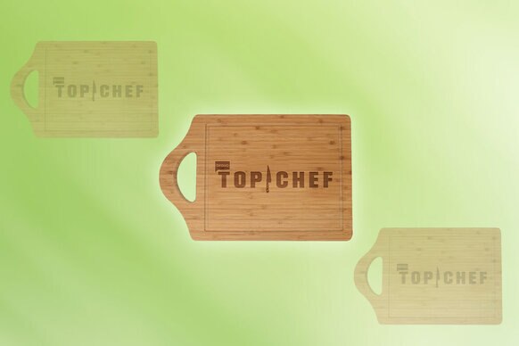 3 wood cutting boards that have "Top Chef" inscribed on them in front of a green background.