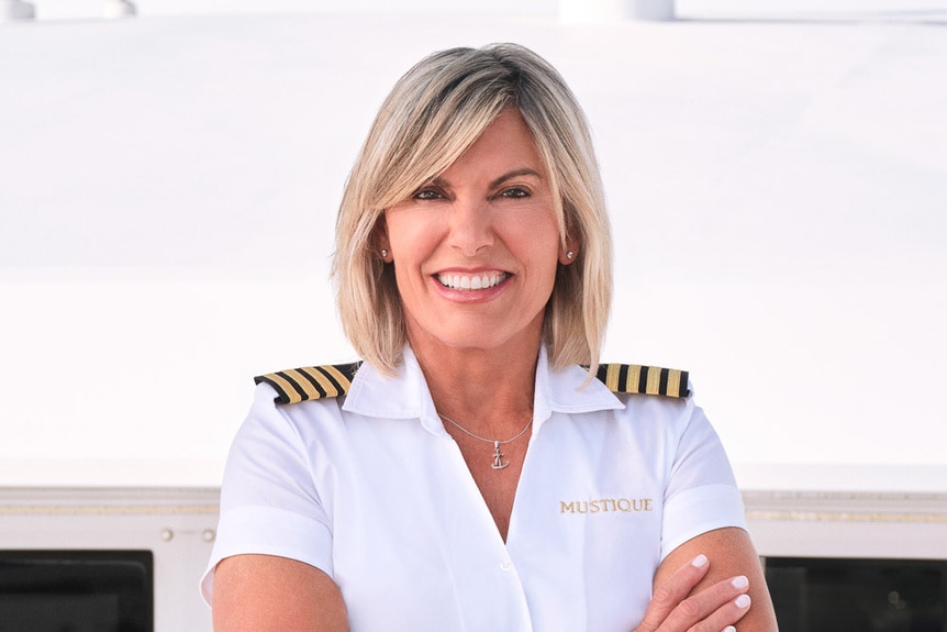 Captain Sandy wearing her yachting uniform.