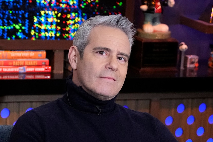 Andy Cohen sitting at the Watch What Happens Live clubhouse in New York City.