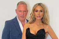 Dorit Kemsley and Paul Kemsley pose together in formal outfits.