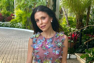 Bethenny outdoors wearing a mesh dress with butterfly appliques.