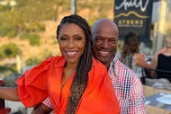 Dr. Jackie Walters with her husband Curtis Berry on an outdoor patio while vacationing in Greece.