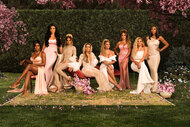 The full cast of RHOP wearing gowns in a garden of cherry blossoms.