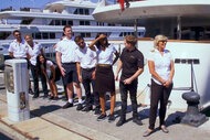 Below Deck Mediterranean Season 8 Cast standing on the marina dock waitng for charter guests.