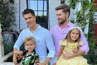 Fredrik Eklund posing with his family outdoors.