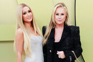 Paris Hilton and Kathy Hilton pose together on a red carpet