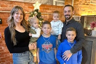 Briana Culberson with her husband Ryan, and their four children, in front of a Christmas Tree.