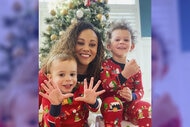 Ashley Darby with her two sons Dean Darby and Dylan Darby in front of their Christmas tree.
