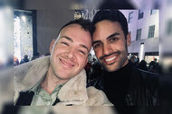 Kyle Viljoen and his husband Zachary Riley smiling together in New York City.
