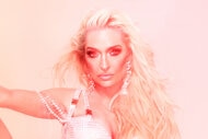Erika Jayne wearing a bedazzled onsie with pink and yellow color treatment over her.