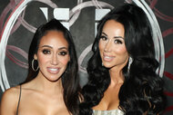 Melissa Gorga and Rachel Fuda posing together in front of a step and repeat.