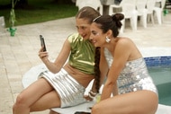Amanda Batula and Paige Desorbo at a party in the Hamptons Summer House