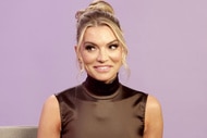 Lindsay Hubbard wearing a brown dress in front of a purple backdrop.