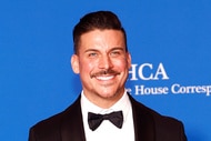 Jax Taylor smiling in front of a step and repeat.