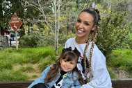 Scheana Shay and Summer Moon sitting together and smiling outdoors.