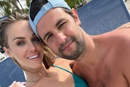 Olivia Flowers wearing a bathing suit poolside with her boyfriend