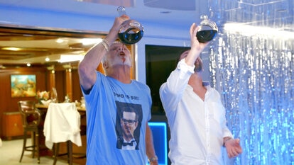 Captain Lee Chugs Red Wine While Wearing a T-Shirt With a Charter Guest's Face On It