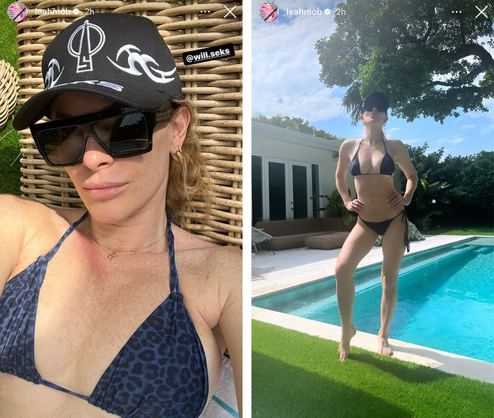 Leah in a navy and black, leopard print, bikini wearing a hat and sunglasses by a pool.