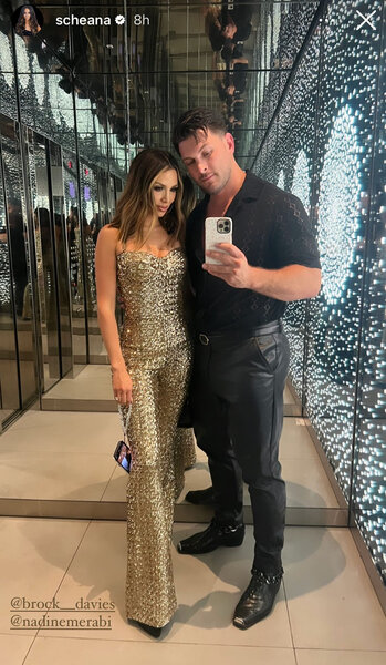 Scheana Shay in NYC with Brock wearing a gold jumpsuit.