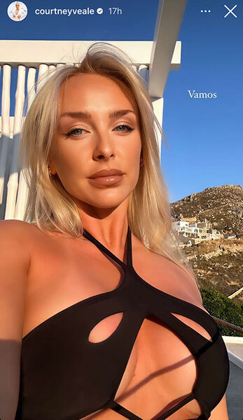 Courtney Veale takes a selfie in a cutout black bikini.