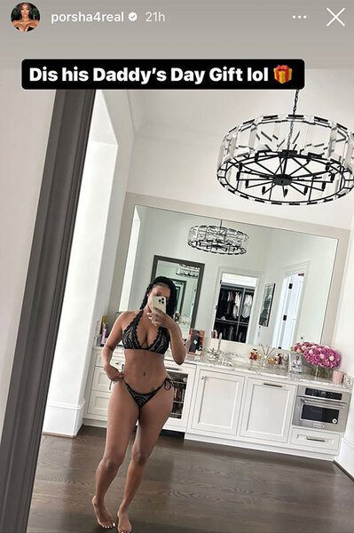 Porsha Williams takes a photo of herself wearing a black bikini in a mirror.