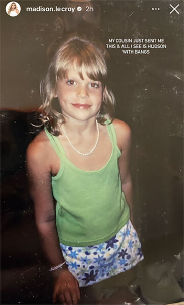 Madison as a child wearing a green tank top and floral skirt.