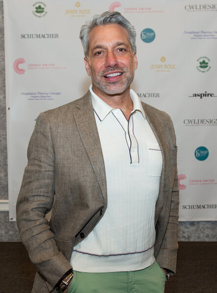 Thom Filicia poses for a photo on a red carpet.