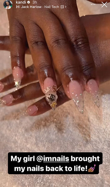 Kandi's newly manicured nails with sparkling appliques.