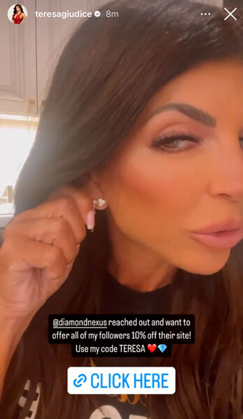 Teresa Giudice shows off her diamond earrings in a selfie.