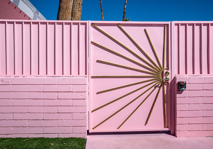 A pink and gold entryway gate at the Trixie Motel in Palm Springs.