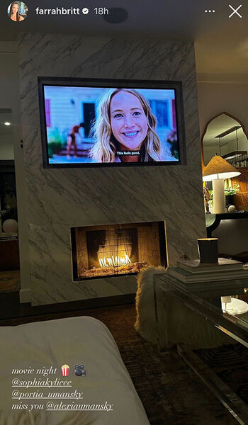 Farrah Britt shows her movie night in her living room with a fireplace. Overlaid text, "Movie night (popcorn emoji) (camera emoji) @sophiakylieee miss you @alexiaumanksy."