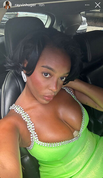 Rayvin Huger taking a selfie in a lime green, fitted, v-cut dress with crystal embellishments while sitting in a vehicle.