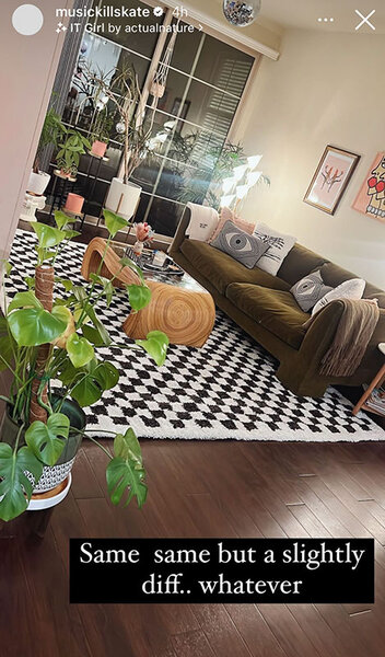 Katie Maloney's living room with an olive green sofa, checkered rug, and plants. Overlaid text: "Same same but a slightly diff... whatever".