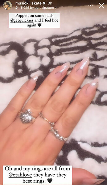 Katie Maloney shows her nails and silver rings. Overlaid text, "Popped on some nails @getquickies and I feel hot again (black heart emoji)". "Oh and my rings are all from @etahlove they have the best rings. (black heart emoji)"