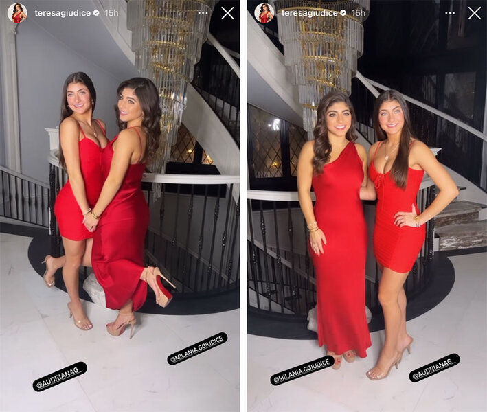 Milania Giudice and Audriana Giudice wearing red dresses and posing in front of a staircase with a large chandelier.