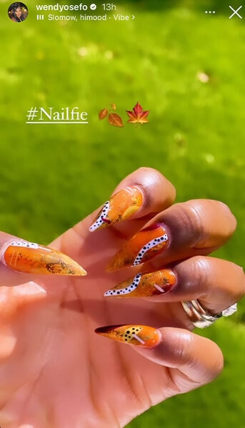 Close up of Wendy Osefo's fall manicure that features leaf texture and other patterns