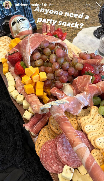 A look at Adrienne Maloof's charcuterie board decorated around a skeleton.