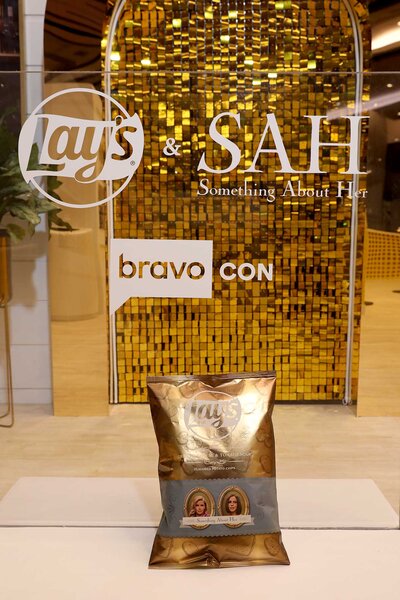 A bag of Lay's Chips in front of Lay's and BravoCon logo at BravoCon 2023