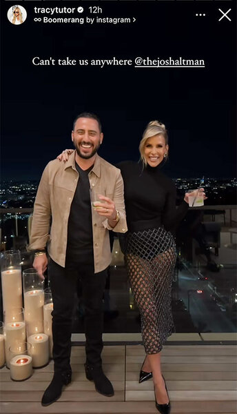 Tracy Tutor and Josh Altman pose for a photo together on a rooftop