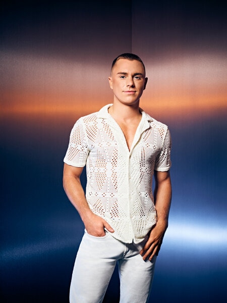 TJ Dinch of Southern Hospitality Season 2 wearing a white lace top and white pants.