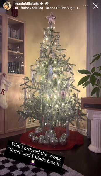 Katie Maloney's Christmas tree decorated with lights and tinsel.