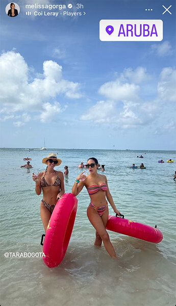 Melissa Gorga holds pink floaties in the ocean with her friend Tara.