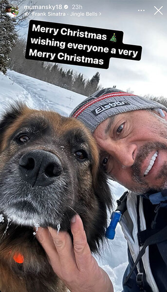 Mauricio Umansky posing outdoors with his dog in Aspen.