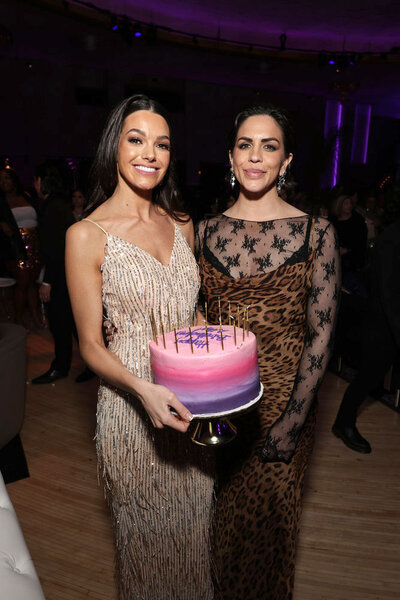 Ally Lewber holding a cake and Katie Maloney at the Vanderpump Rules Season 11 premiere party
